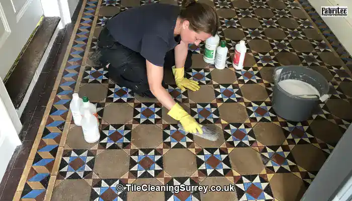 Victorian tiles with haze and dull patches caused by unsuitable cleaning.